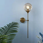 Globe Sconces With Glass Sphere And Exposed Bulb - Image 3