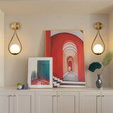 Gold Wall Globe Sconces With Teardrop Frame - Image 1