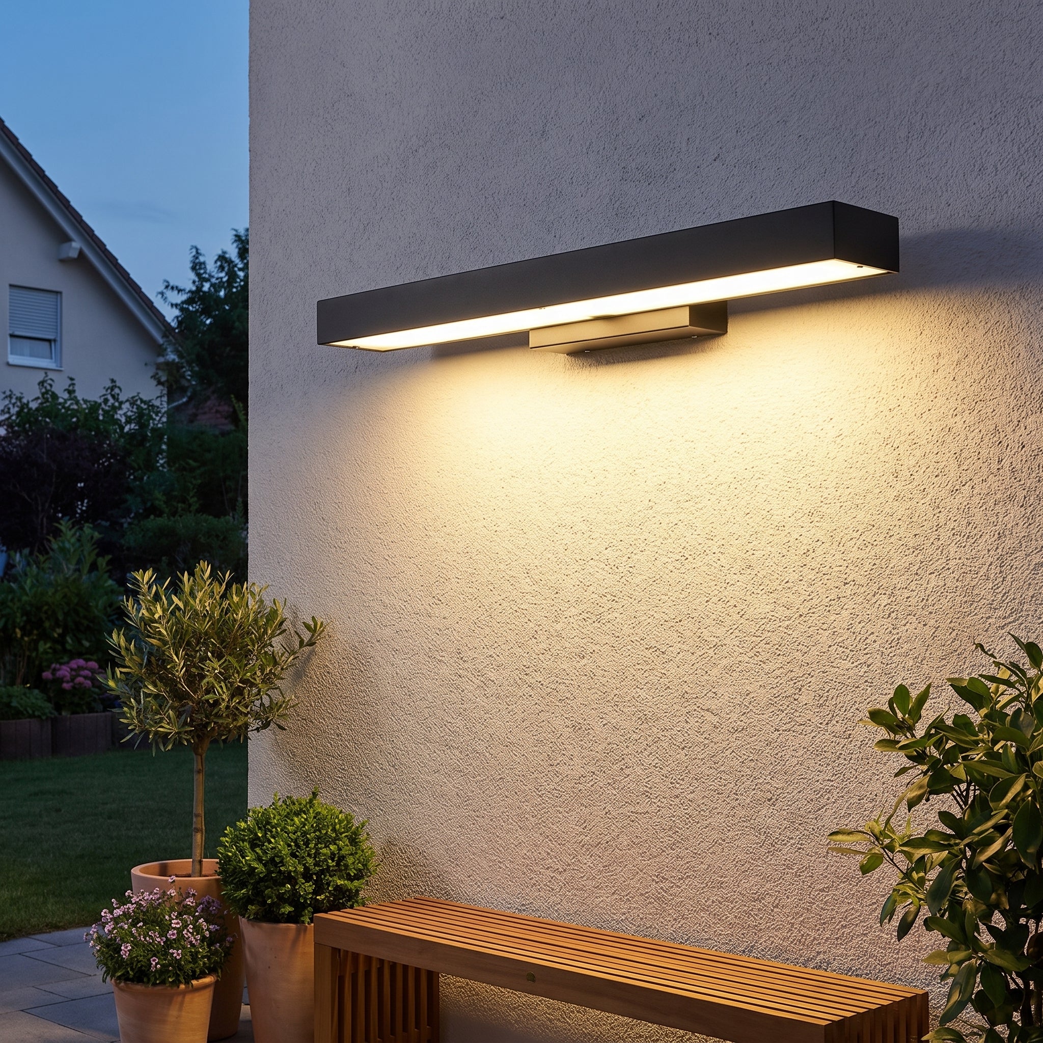 Outdoor Wall Sconce with Streamlined Rectangular Unit and LED - in-use